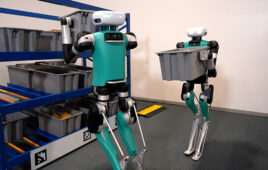agility robotics digit robots handle totes in a warehouse.